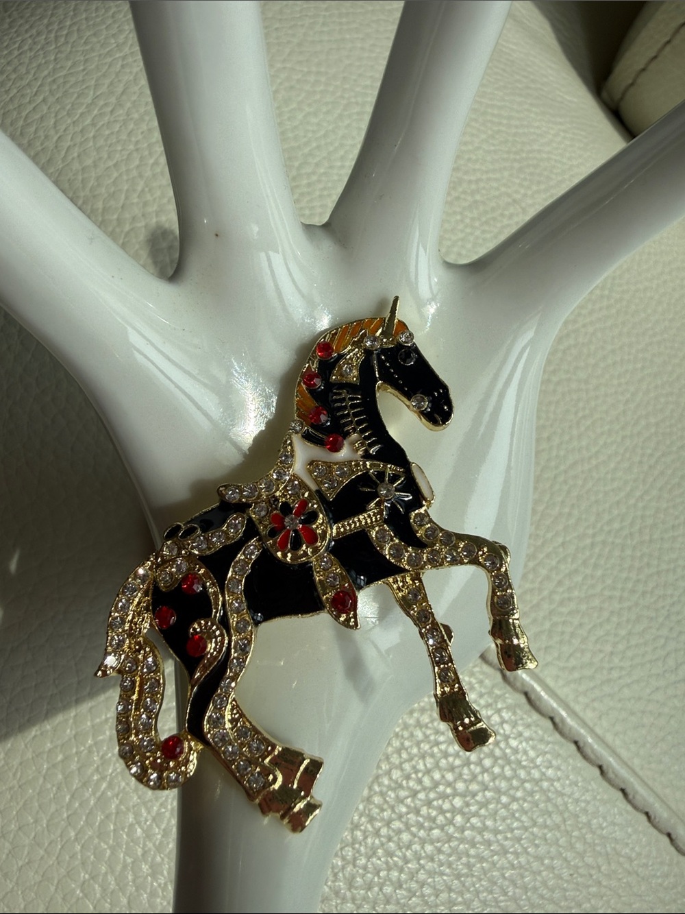 Gold-Tone Black Enamel Unicorn Brooch with Red Accents